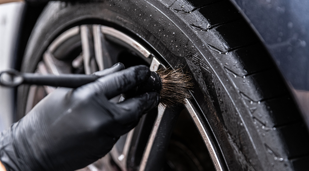 Close-Up of Detailing Brush and Wheel Cleaner on Car’s Wheels and Wheel Wells at Car Detailing Omaha NE
